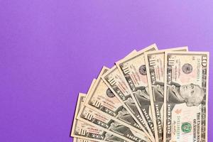 A Hundred dollar currency fan close up, Top view of business concept on colored background with copy space photo