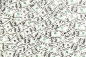 Top view of one hundred dollar banknotes made as a background. USD currency concept. Texture of American dollars photo