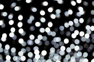 Abstract blur black and white bokeh background. many round light on background photo