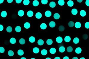 Unfocused abstract colourful bokeh black background. defocused and blurred many round blue light photo