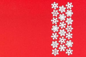Top view of winter ornament made of white snowflakes on colorful background. Happy New Year concept with copy space photo