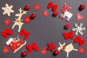 Christmas black background with holiday toys and decorations. Happy New Year concept with empty space for your design photo