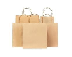 Five Recycled paper shopping bags isolated on white background photo