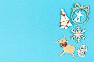Top view of festive composition made of New Year decorations on colorful background. Merry Christmas concept with empty space for your design photo
