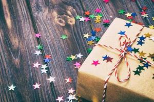 Christmas decoration with gift box for celebration with confetti Star best Christmas holidays background. Toned photo