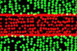 Unfocused abstract green and red bokeh on black background. defocused and blurred many round light photo