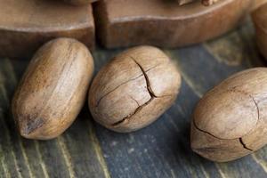 Pecan in a shell on the table photo