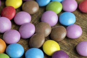 Multicolored chocolates with chocolate filling photo