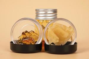 bottles with different varieties of cannabis golden  wax extract photo