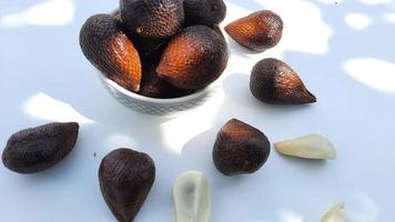 Salak fruit in a bowl on a white background, Top angel 06 photo