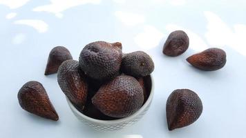 Salak fruit in a bowl on a white background, Top angel 02 photo