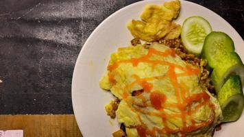 Japanese Cuisine Homemade Omurice with rice, Eggs and vegetables Top angel on table 02 photo