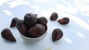 Salak fruit in a bowl on a white background, Top angel 04 photo