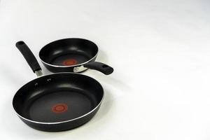 set of cooking pans on white background, mexico photo