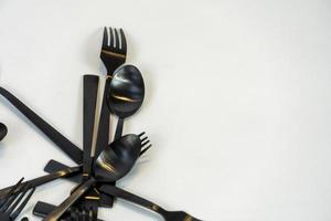 kitchen spoons and knives in black metal, mexico photo