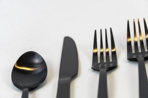 kitchen spoons and knives in black metal, mexico photo