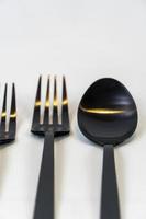 black metal forks and spoons on a white background, mexico photo
