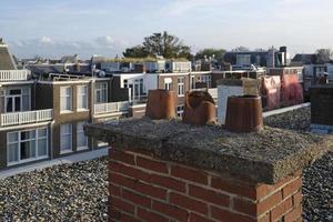 Rooftop view in The Hague, Netherlands, with chimneys in the foreground photo