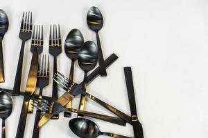 black metal Dinnerware Cutlery Utensils, Forks Knives, Spoons on Gray Background mexcio photo