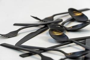 black metal forks and spoons on a white background, mexico photo