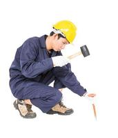 Man hold hammer and cold chisel on white photo
