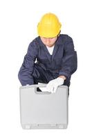 Young handyman sitting with his tool box photo