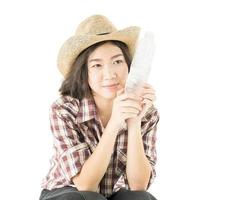 Woman in a plaid shirt holding a water bottle on white background photo