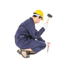 Man hold hammer and cold chisel on white photo