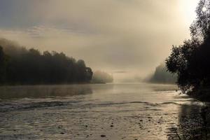 Foggy morning on the river photo