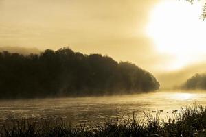 Foggy morning on the river photo