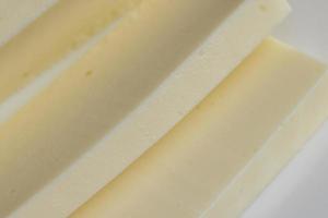 Sliced cream cheese for salads photo