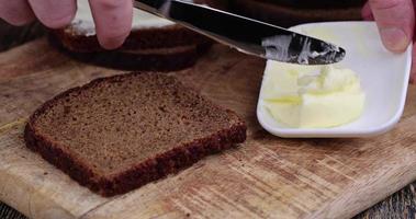 Making sandwiches with rye bread and butter photo