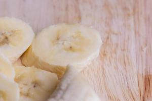 Sliced ripe banana on a cutting board photo