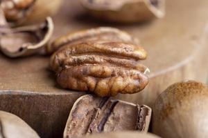 Pecan in a shell on the table photo