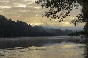 Foggy morning on the river photo