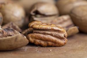 Pecan in a shell on the table photo