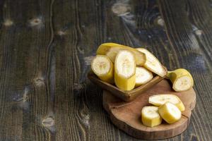 Sliced ripe yellow banana, close up photo