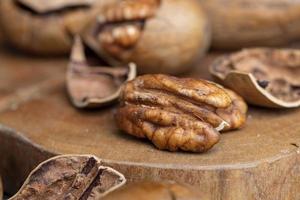 Pecan in a shell on the table photo