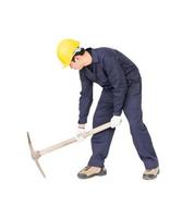 Man in uniform hold old pick mattock that is a mining device photo