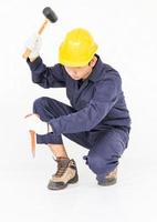 Man hold hammer and cold chisel on white photo