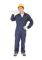 Worker holding blueprint on white photo