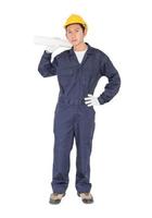 Worker holding blueprint on white photo