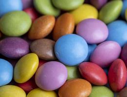 Multicolored chocolates with chocolate filling photo