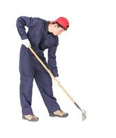 Gardener with garden tools on white photo