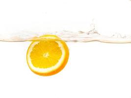 orange floating in the water on a white background photo