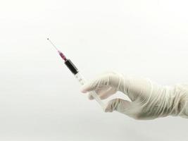 hand with blood syringe photo