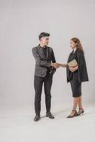 Two confident businessman shook hands during office meetings. photo