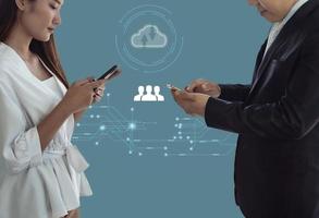 Social media community concept, Business people using smartphone searching information from internet and contact customer, isolated on light blue background. photo