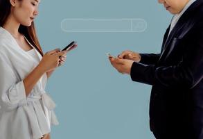Social media community concept, Business people using smartphone searching information from internet and contact customer, isolated on light blue background. photo