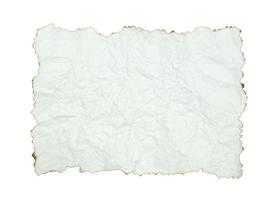 crumpled paper with burnt edges over white photo